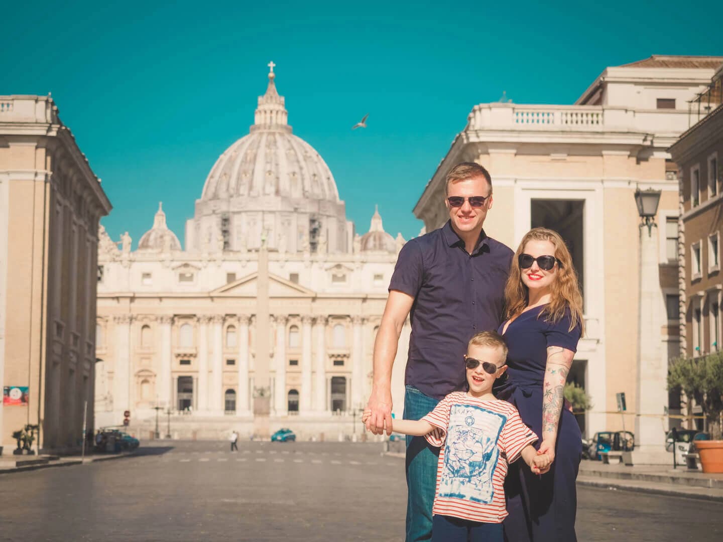 Family wearing coordinated outfits for a photoshoot in Italy